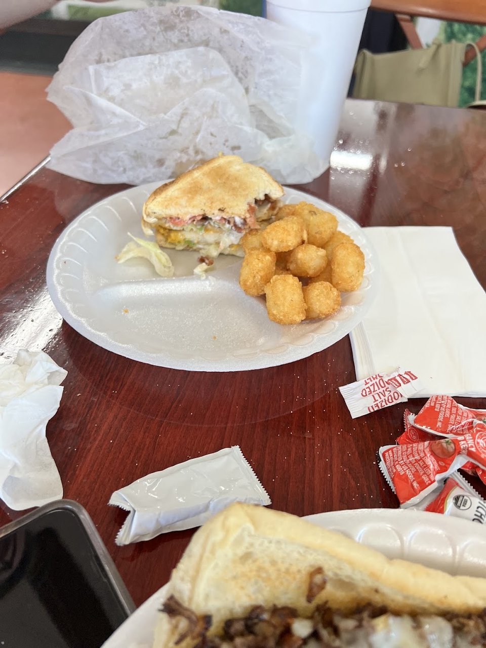 Milkshakes and fast food favorites on the table.